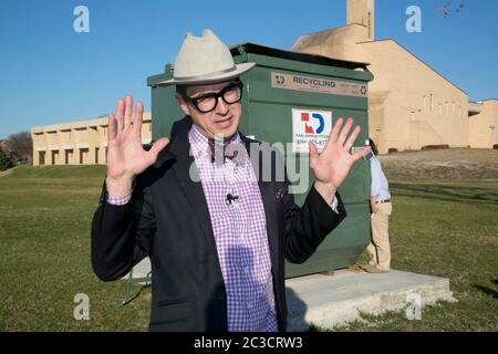 Austin Texas USA, February 12, 2014: Huston Tillotson University environmental science professor Dr. Jeff Wilson plans to male a 330 square-foot dumpster his home for a full year. By living in the dumpster, he will experiment with innovative ways to live with less and practice low-waste living principles.   ©Marjorie Kamys Cotera/Daemmrich Photography Stock Photo