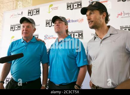 Austin, Texas USA April 25, 2014: Oscar-winning actor Matthew McConaughey (right) joins former University of Texas head football coach Mack Brown and country singer Jack Ingram at a press conference promoting their Mack, Jack & McConaughey fundraiser, which supports select non-profit organizations that share the principals' goal to empower children.  ©Marjorie Kamys Cotera/Daemmrich Photography Stock Photo