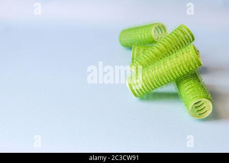 Hair culers on the blue backround. Green culers for hairdress. Stock Photo