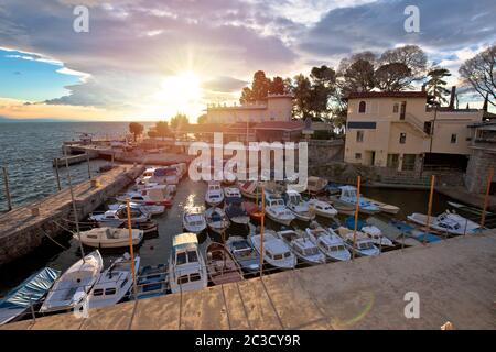 Town of Lovran waterfront and harbor sunset view Stock Photo