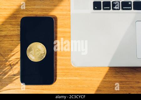 Coin bitcoin business digital finance electronic on smartphone and on desk table office. Stock Photo