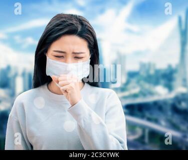 Asian  woman suffer from cough with face mask protection Stock Photo