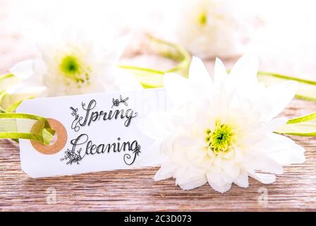 One Label With English Calligraphy Spring Cleaning. White Spring Flower Blossom On Wooden Background Stock Photo