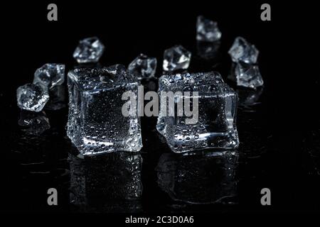 ice cubes on black isolated glass background Stock Photo