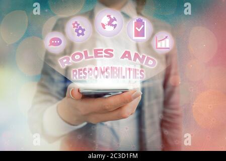 Text sign showing Roles And Responsibilities. Business photo showcasing Business functions and professional duties Stock Photo