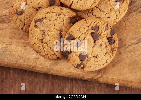 Chocolate chip cookies close-up on a rustic wooden background Stock Photo