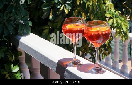 Aperol spritz in big glasses red summer cocktail, terrace party. High quality photo Stock Photo