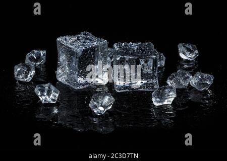 ice cubes on black isolated glass background Stock Photo