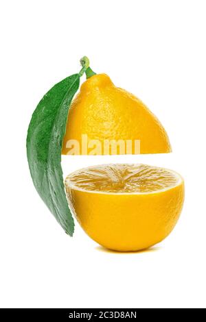 yellow lemon cut into two parts with a leaf isolated on a white background Stock Photo