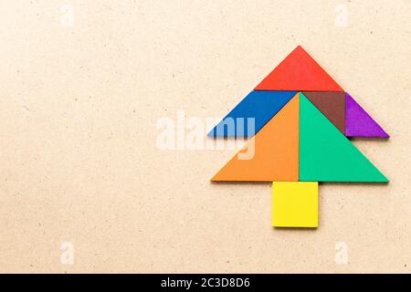 Color tangram puzzle in Pine or christmas tree shape on white ...