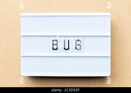 White lightbox with word bug on wood background Stock Photo