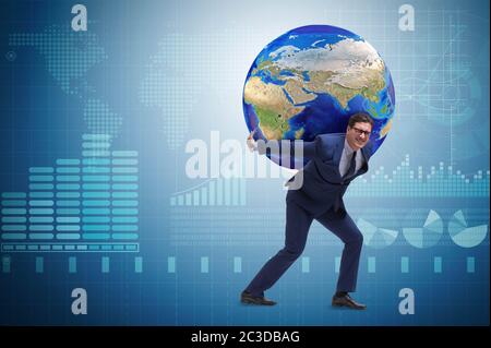 Businessman carrying Earth on his shoulders Stock Photo