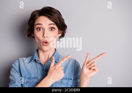 Portrait of astonished girl point index finger copyspace indicate incredible adverts promo impressed scream wow omg wear good look clothes isolated Stock Photo