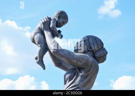 The Bronze Woman statue, depicting an African-Caribbean woman and child held aloft is said to be the first of its kind on permanant display in England. Stock Photo