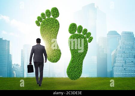 Carbon footprint concept with businessman Stock Photo