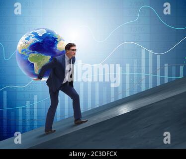 Businessman carrying Earth on his shoulders Stock Photo