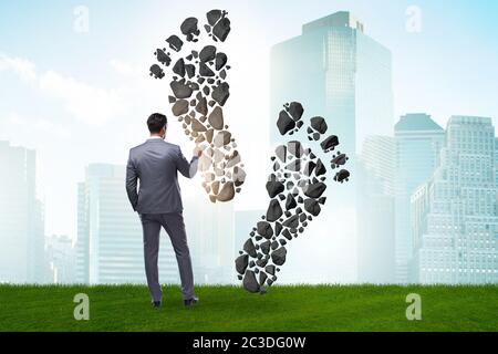 Carbon footprint concept with businessman Stock Photo