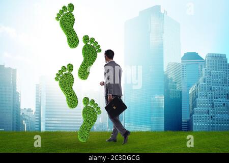 Carbon footprint concept with businessman Stock Photo