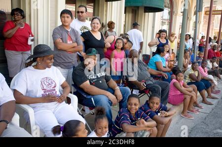 Bastrop, Texas, USA. 21st June, 2008. Bastrop, TX June 21, 2008: Parade-watchers in small-town at a Juneteenth celebration in the historically African-American suburb of Bastrop, outside Austin. Juneteenth celebrates the day, June 19, 1865 when Union soldiers landed in Galveston, TX announcing the end of slavery and the Civil War. Credit: Bob Daemmrich/ZUMA Wire/Alamy Live News Stock Photo