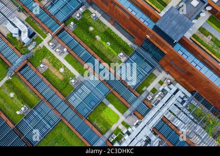 Air Condition Ventilation System Green Grass Ecology. Building Roof. Industrial Air system of ventilation and Air conditioning. Aerial Shot. Stock Photo