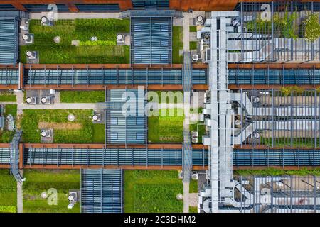 Air Condition Ventilation System Green Grass Ecology. Building Roof. Industrial Air system of ventilation and Air conditioning. Aerial Shot. Stock Photo