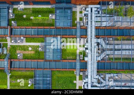 Air Condition Ventilation System Green Grass Ecology. Building Roof. Industrial Air system of ventilation and Air conditioning. Aerial Shot. Stock Photo