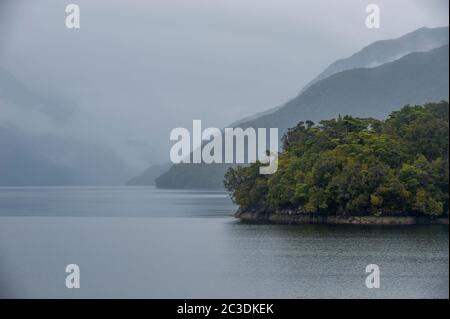 Dusky Sound in the rain in Fjordland National Park on the South Island of New Zealand. Stock Photo