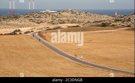 Cape Greko, Cyprus, June 08 2020: Tourist people trekking on a road at Cape Greko peninsula Paralimni area in Cyprus Stock Photo