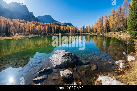 Autumn alpine mountain lake near San Pellegrino Pass, Trentino, Dolomites Alps, Italy. Stock Photo