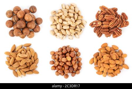 Collection of nuts heaps isolated on white, top view Stock Photo