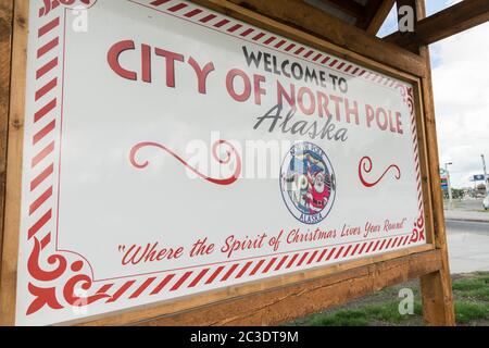 Sign welcoming visitors to North Pole, Alaska. The tiny town is home to the Santa Claus House and Shop, a popular tourist destination. Stock Photo