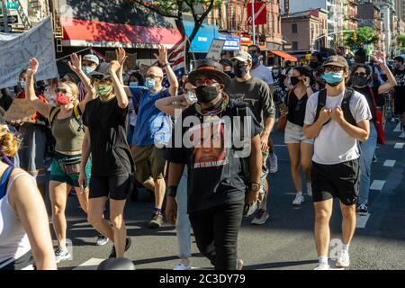 Black Lives Matter demonstrators march in Chelsea in New York protesting the death of George Floyd and calling for defunding the police, seen on Tuesday, June 16, 2020. (© Richard B. Levine) Stock Photo