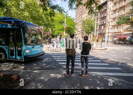 MTA bus approaches intersection in Greenwich Village in New York on Tuesday, June 16, 2020. (© Richard B. Levine) Stock Photo