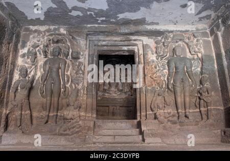 Lord Mahavira flanked by Parsvanath (lft)  and Bahubal in the Jain Temple (Indra Sabha), Ellora Cave 32, Aurangabad, Maharashtra, India. Stock Photo