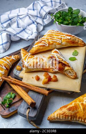 Puff pastry apple pastry turnovers for dessert. Stock Photo