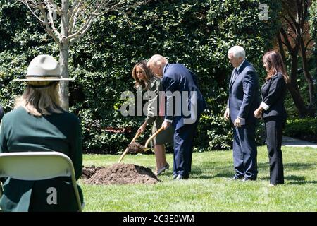 President Donald J. Trump, First Lady Melania Trump, Vice President Mike Pence, and Second Lady Karen Pence participate in a tree planting ceremony in honor of Earth Day and Arbor Day Wednesday, April 22, 2020, on the South Lawn of the White House. Stock Photo
