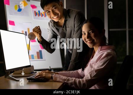 Teamwork analysis and working Late at night. Stock Photo