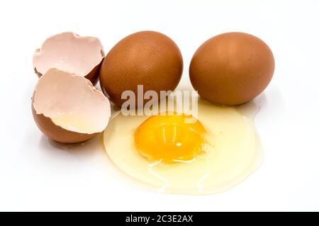 Egg yolk and white on white background Stock Photo