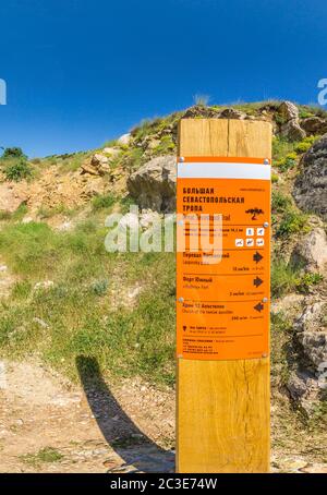 information post on the Great Sevastopol trail. The mountain road begins in Balaklava, Crimea Stock Photo