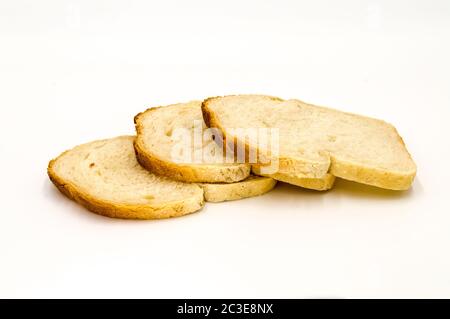 Wheat bread with bran slice. Cooking the dough. Isolated on white background. Stock Photo