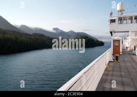 A BC ferry boat ploughing the Inside Passage route in the Pacific waters of the Great Bear Rainforest, near Klemtu, British Columbia, Canada. Stock Photo