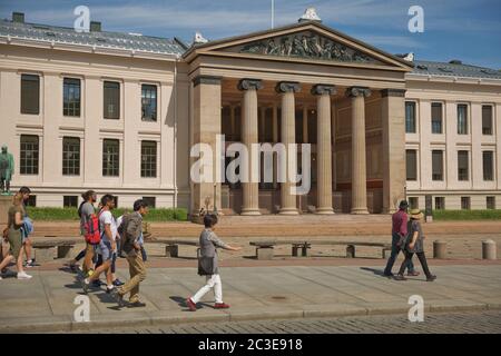 People walking in front of University of Oslo in Norway. Central campus Stock Photo