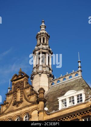 ornate stone towers and domes on the roof of leeds city market a historical building in west yorkshire england Stock Photo