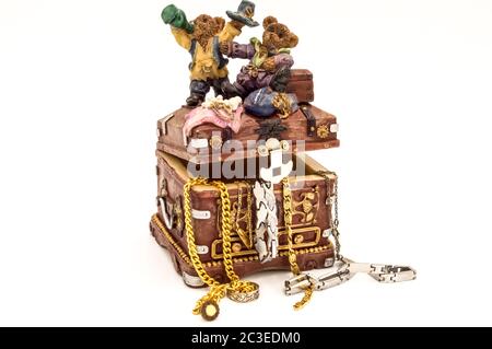 Treasure chest filled with jewelry on white background Stock Photo
