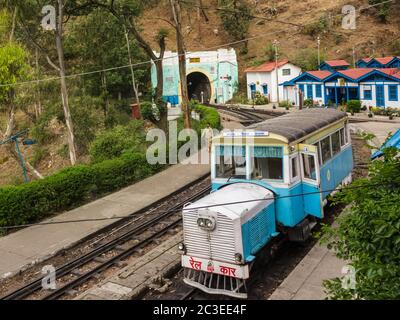 Barog, Himachal Pradesh, India - May 2012: A vintage rail motor car going from Kalka to Shimla stops at the Barog Railway Station. Stock Photo