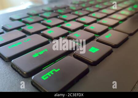 Moscow, Russia - June 04, 2019: green Windows button on a keyboard with lighting Stock Photo