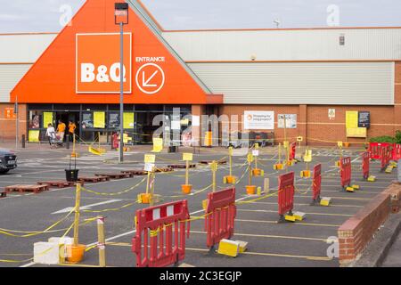 Queuing system outside B&Q diy store when reopened with strict social distancing for DIY, home improvement and garden centre England UK Stock Photo