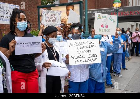 New York, USA. 18th June, 2020. Health workers hold up Black Lives Matter signs as they demonstrate outside the Lenox Hill hospital in New York City to mark Juneteenth, commemorating the ending of slavery in the United States in 1865. Credit: Enrique Shore/Alamy Live News Stock Photo
