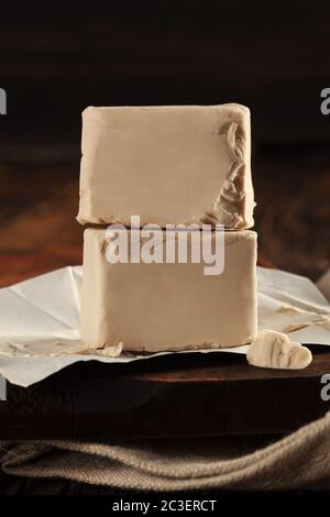 Fresh pressed yeast cubes Stock Photo