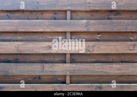 Old wooden texture painted with varnish. Fence or a fence of horizontal planks. Parallel slats of solid pine at intervals Stock Photo